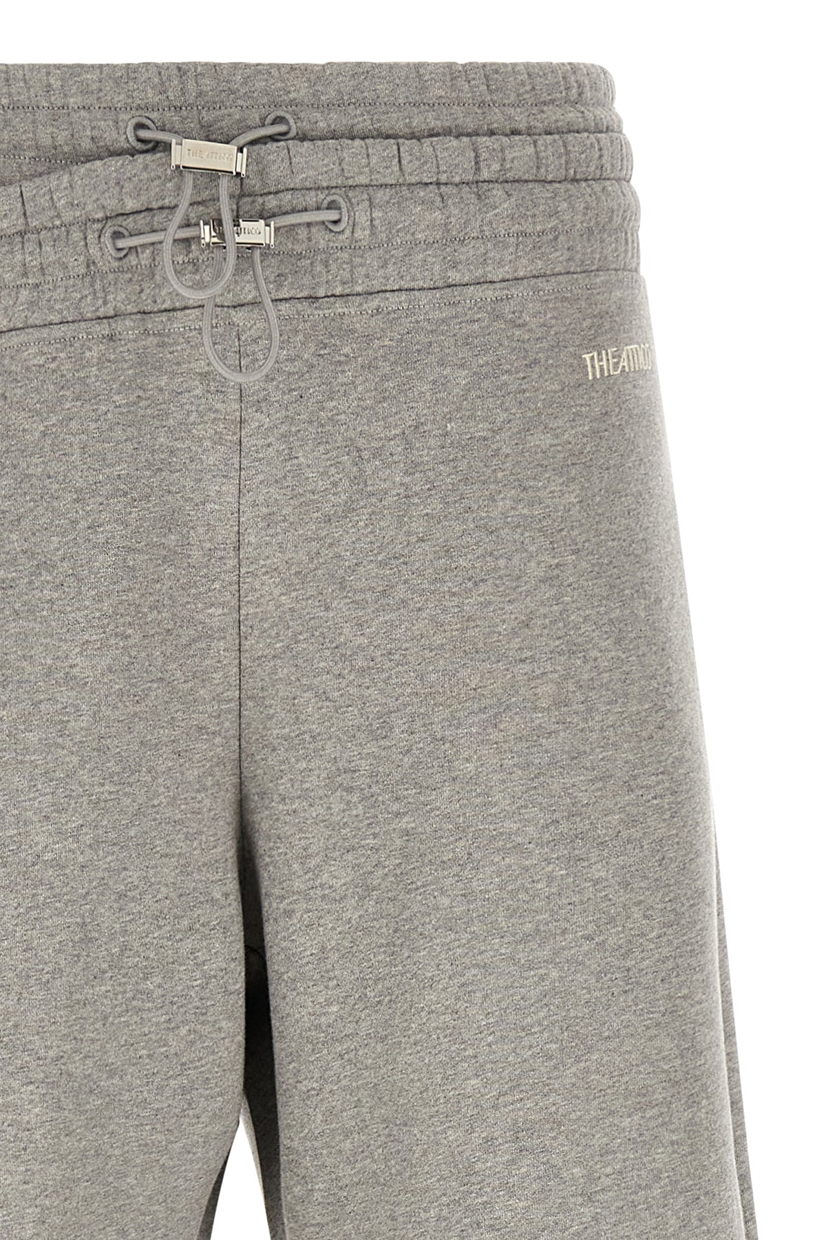 Asymmetrical double waist trousers