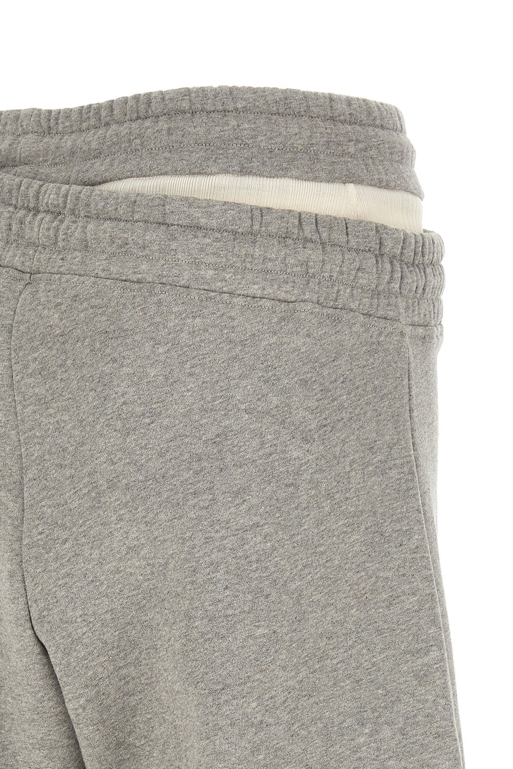 Asymmetrical double waist trousers
