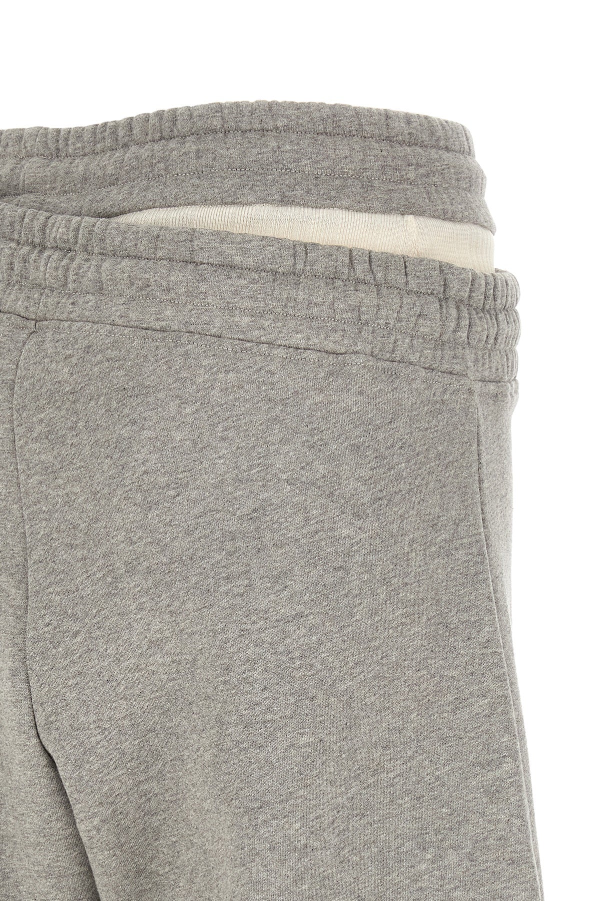 Asymmetrical double waist trousers